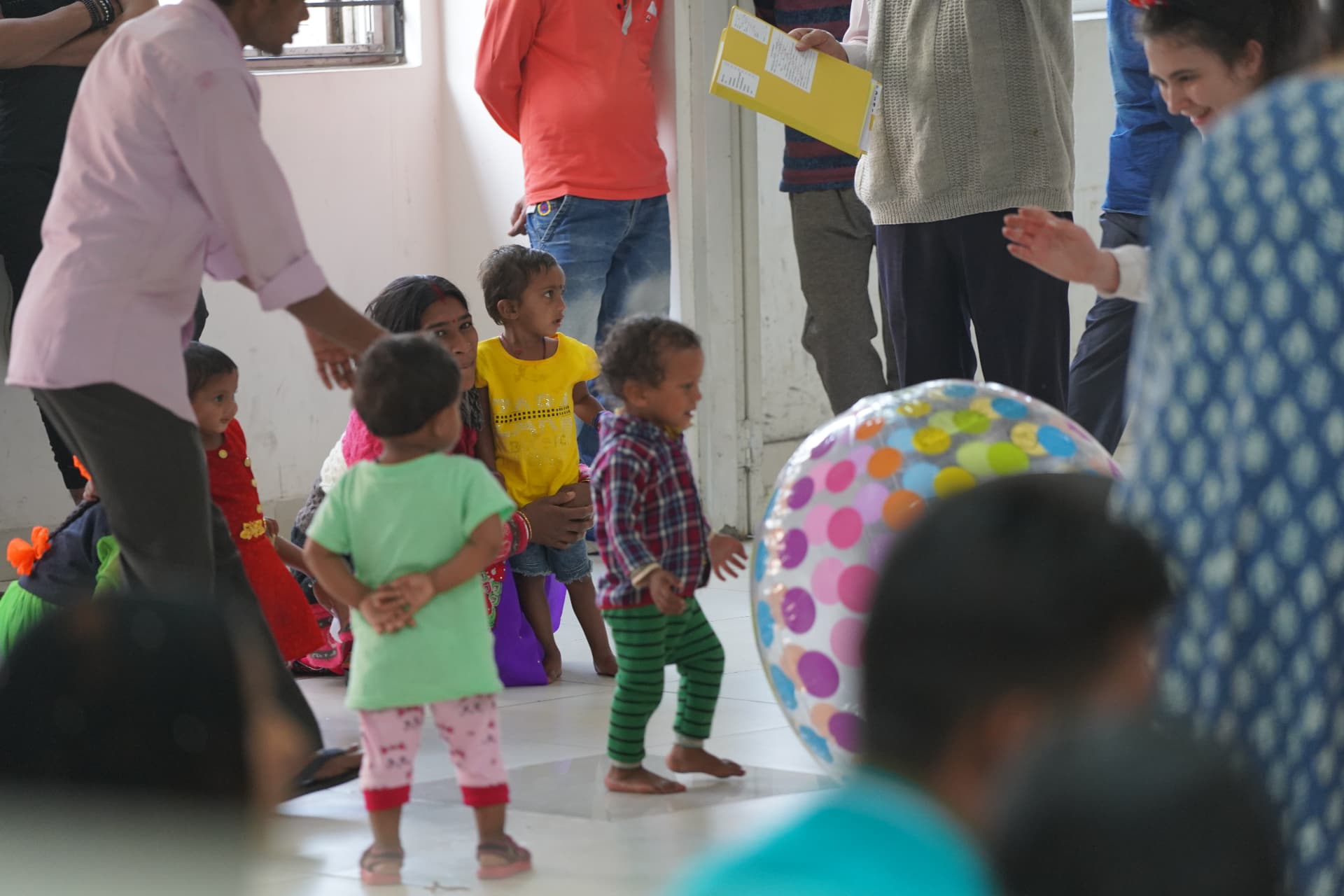 Young children playing together at a community program
